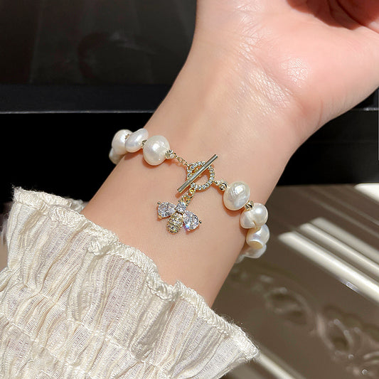 Bee with pearl bracelet